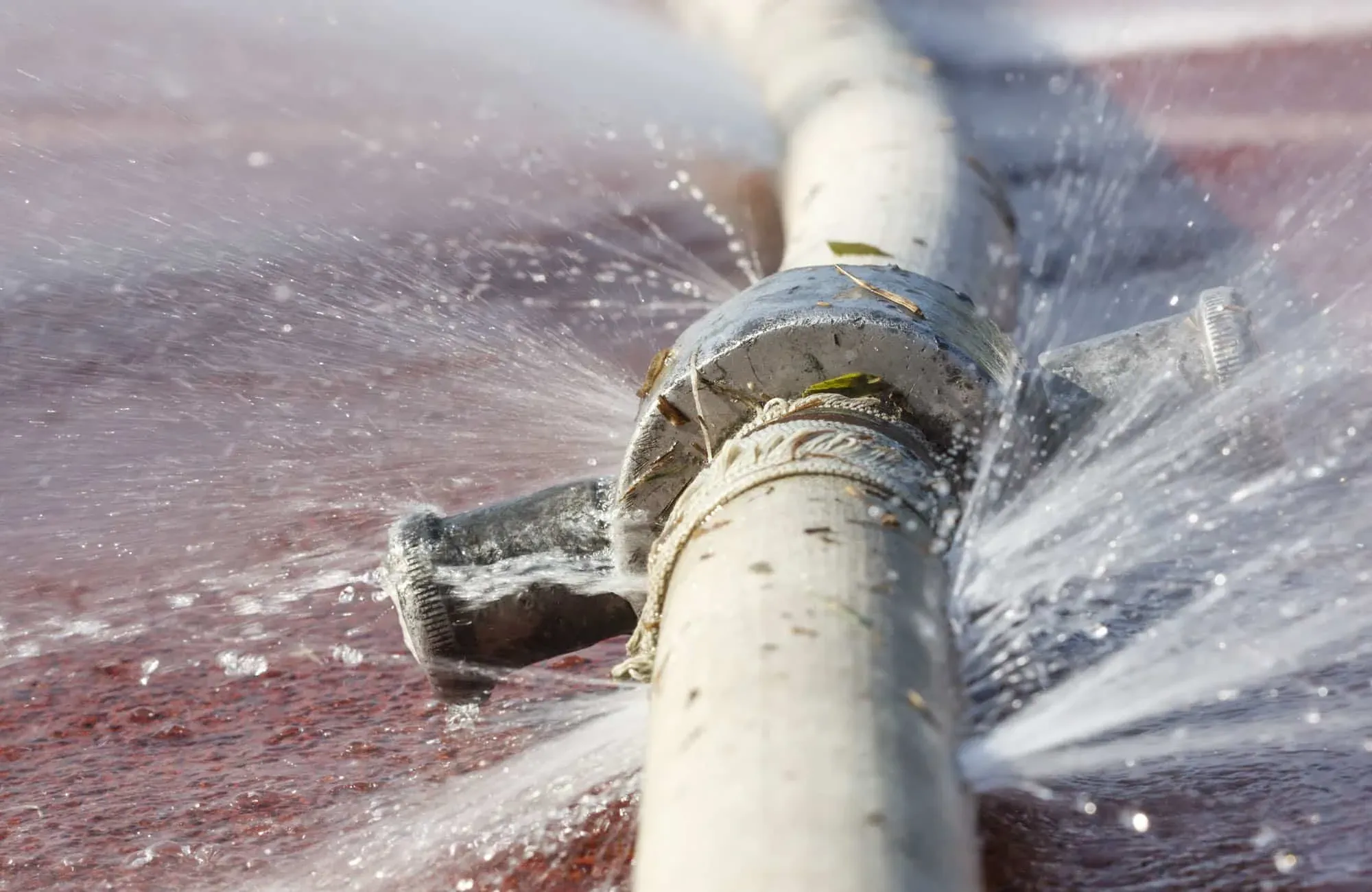 Water spraying from a burst pipe