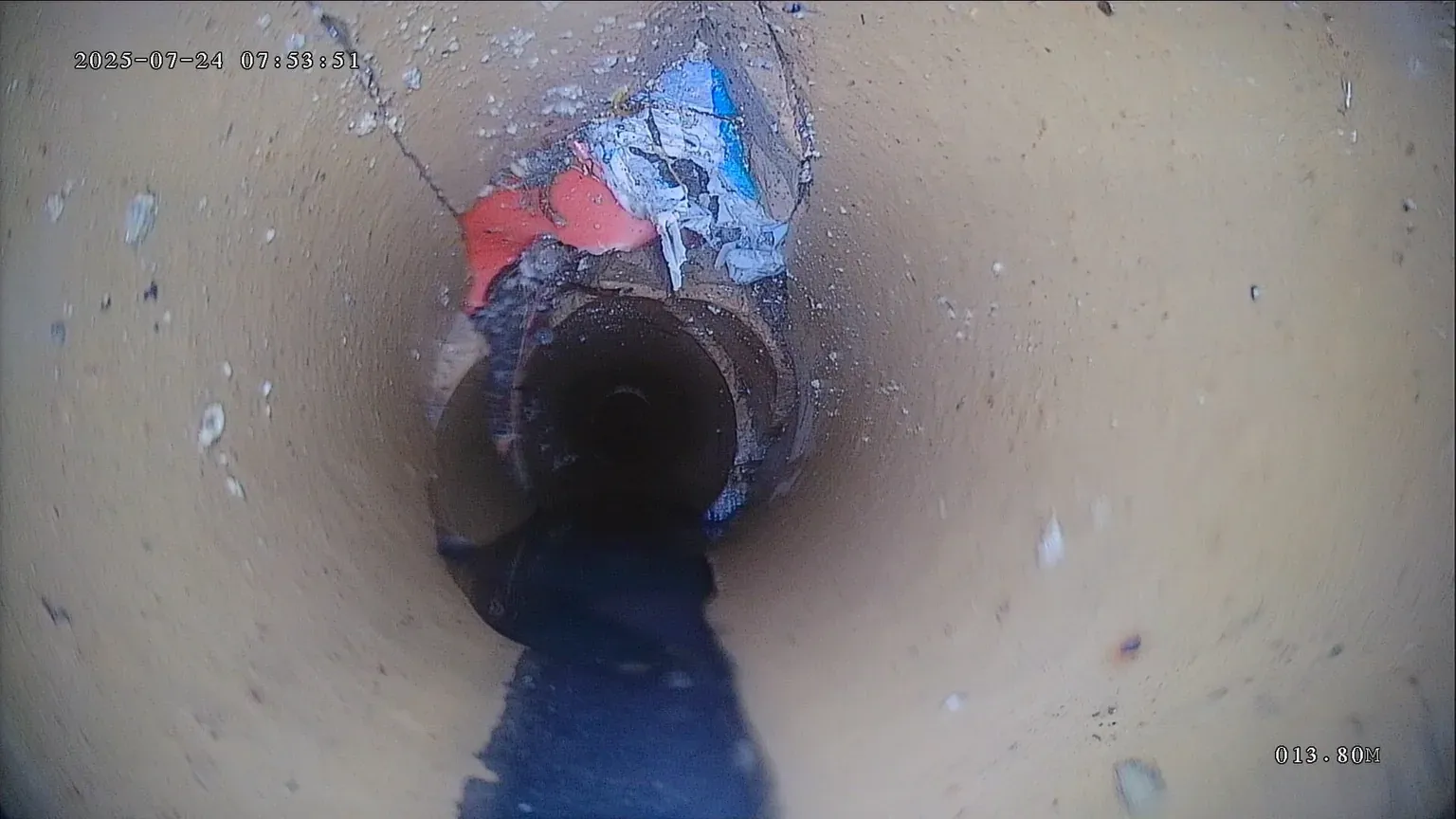 CCTV drain camera footage of a displaced joint inside a drain pipe