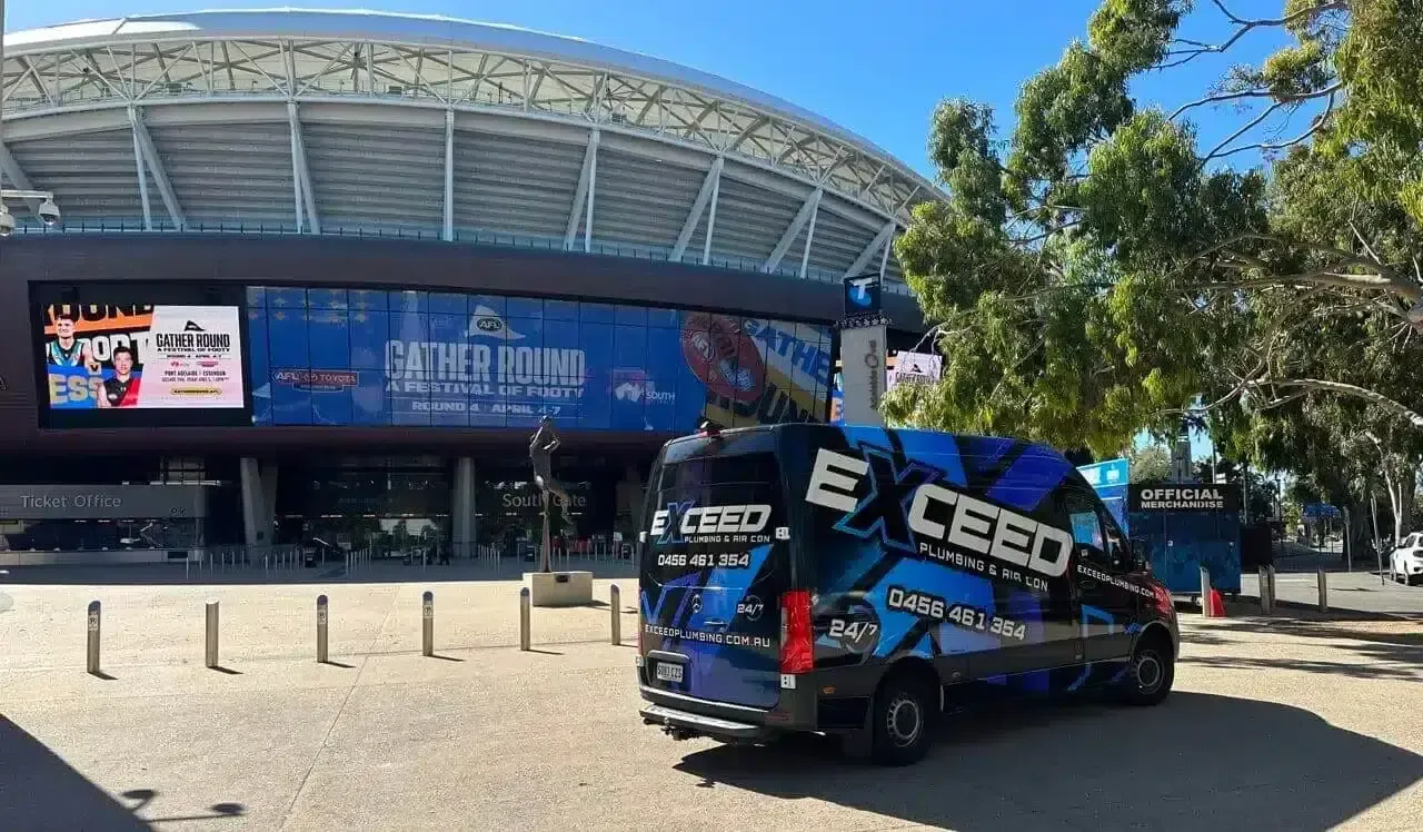 The Exceed Plumbing & Air Con service van parked outside Adelaide Oval