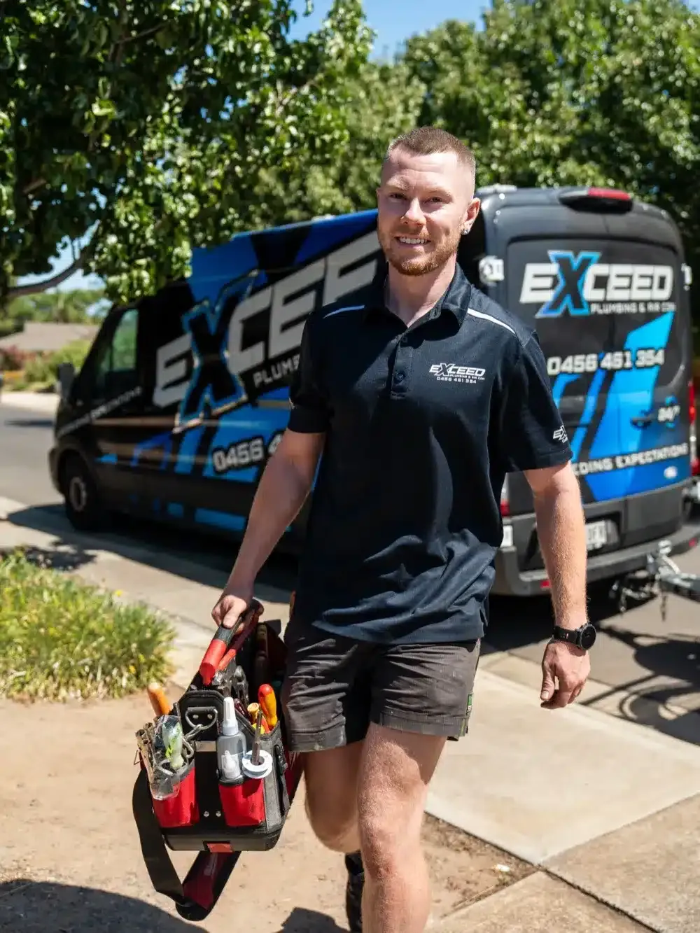 Caleb John of Exceed Plumbing arriving at a job with his tool bag