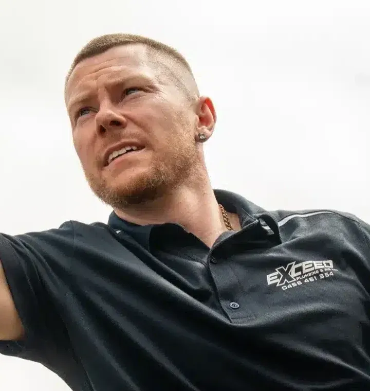 Caleb John, owner of Exceed Plumbing, on a job