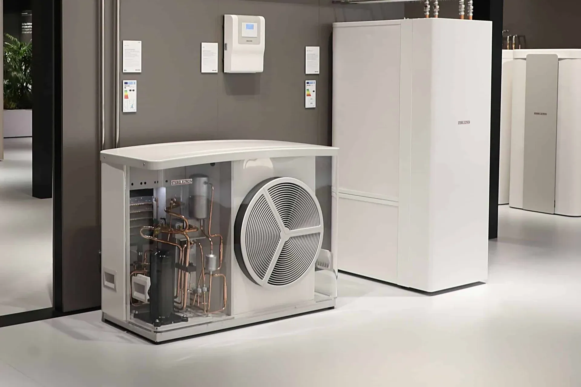 Heat pump hot water units with the compressor visible