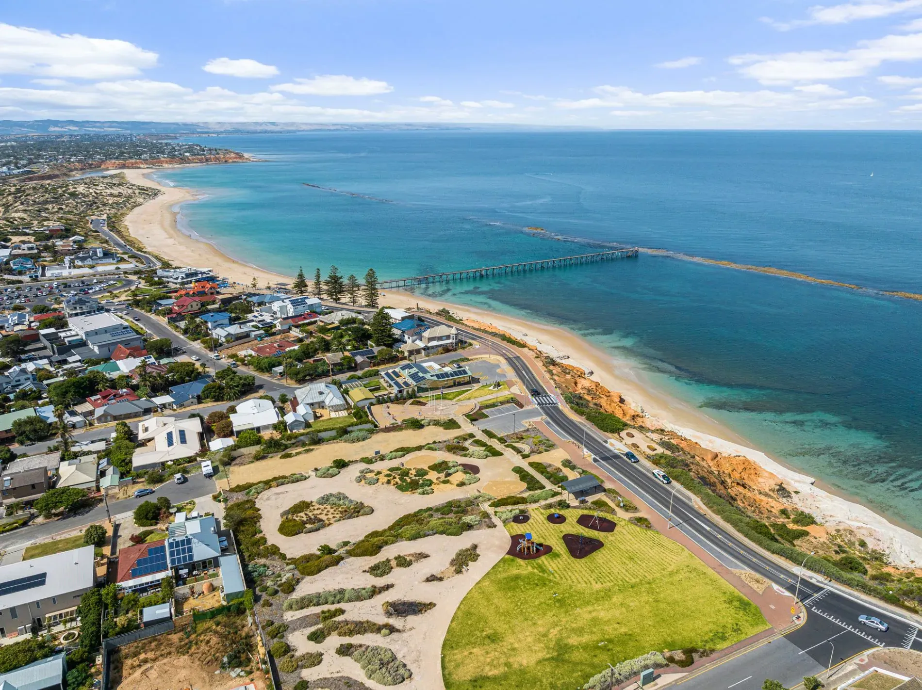 Aerial view of the Port Noarlunga coast, jetty and homes