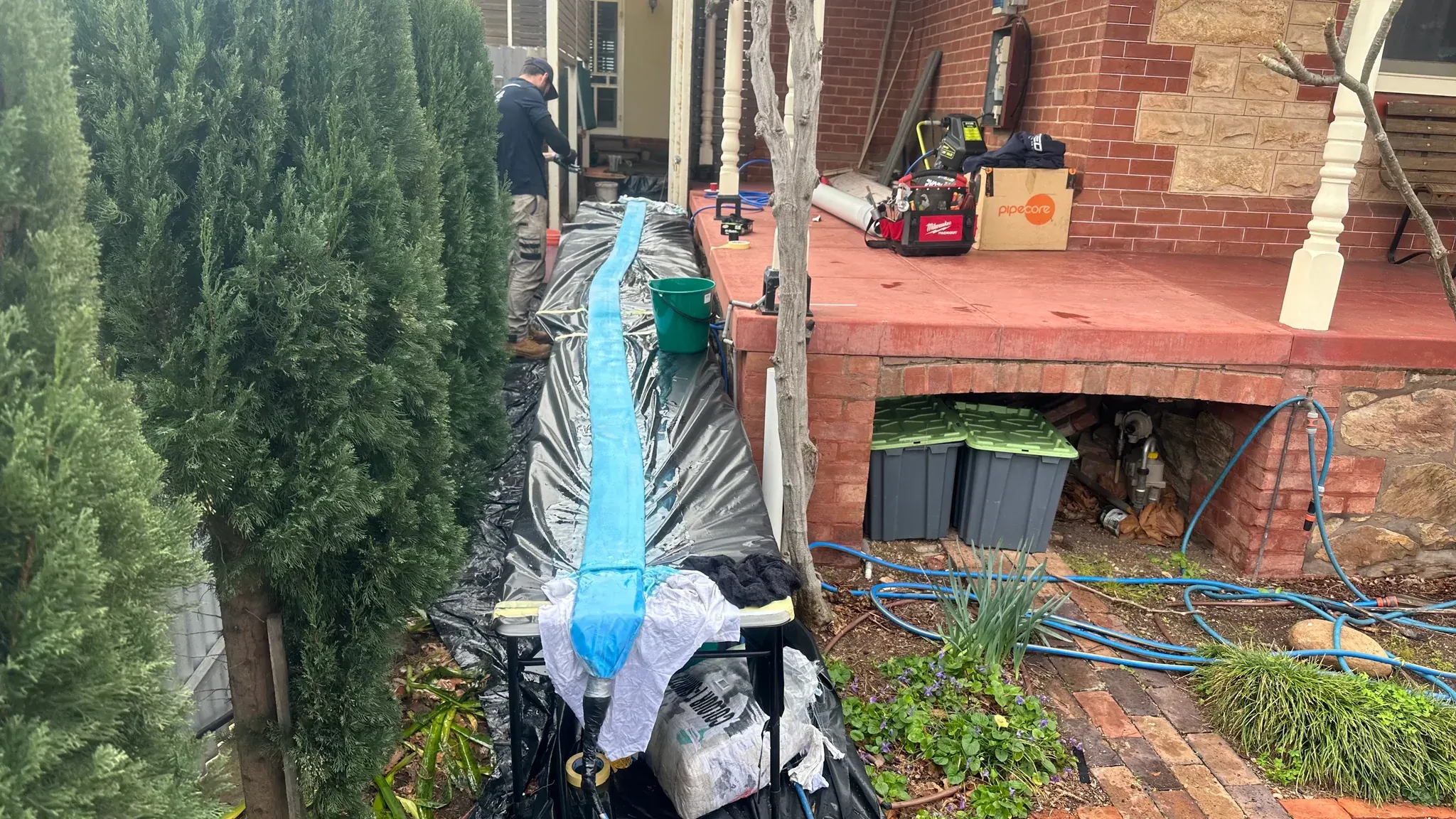 Pipe relining liner laid out beside an Adelaide home, ready to feed through one access point