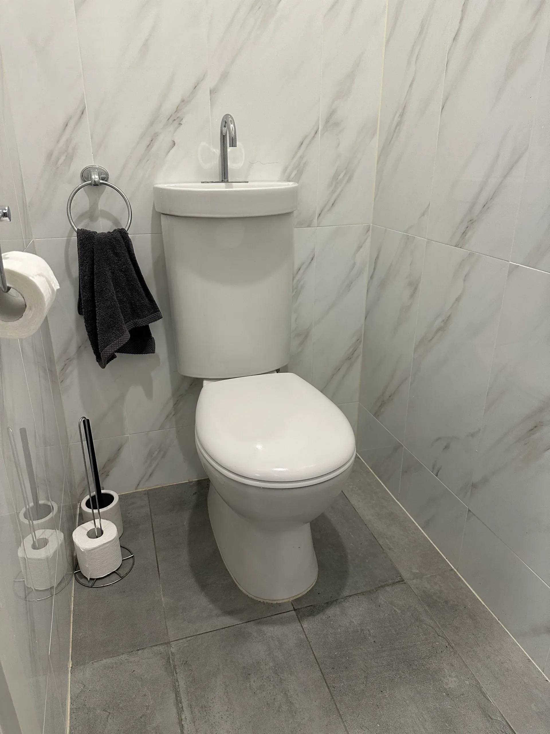 Toilet suite installed in a tiled bathroom