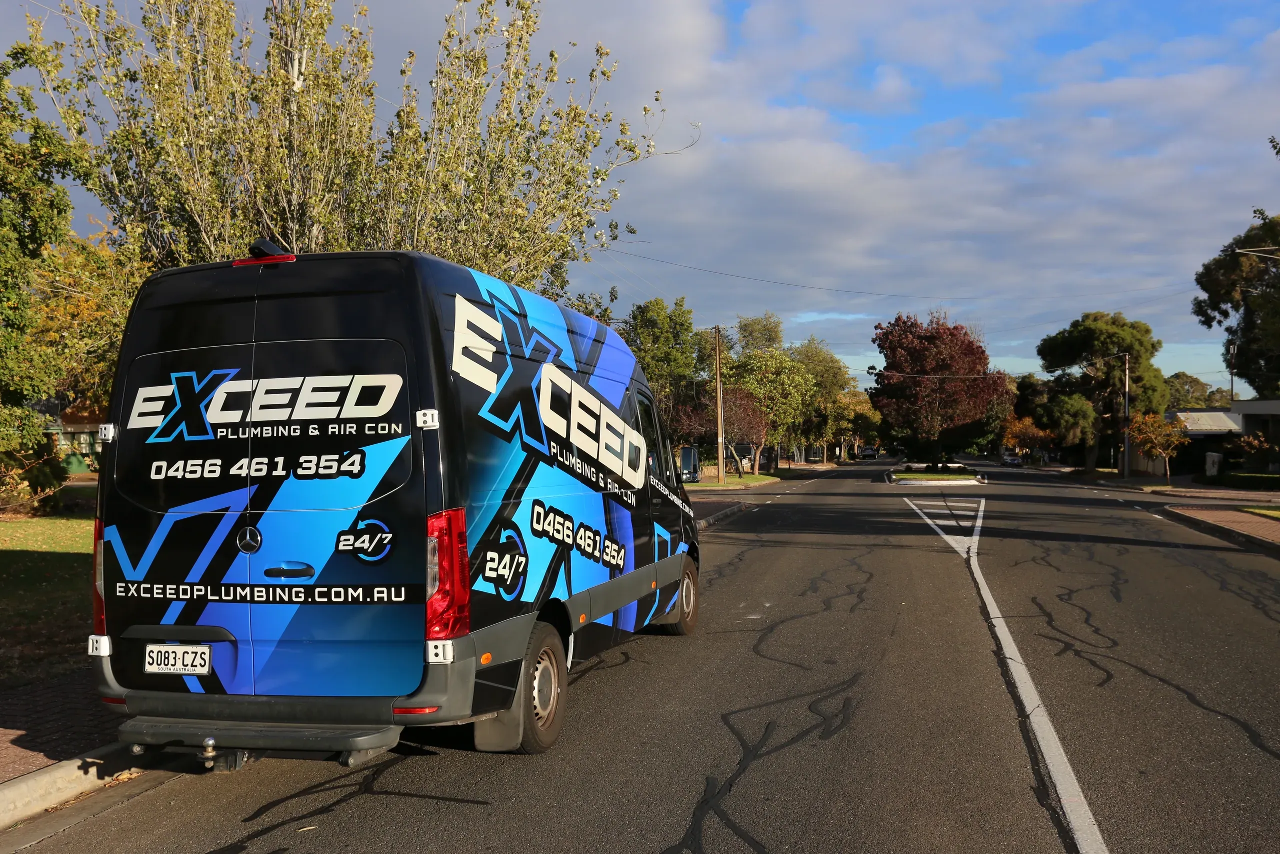The Exceed Plumbing van parked on a leafy street in Linden Park
