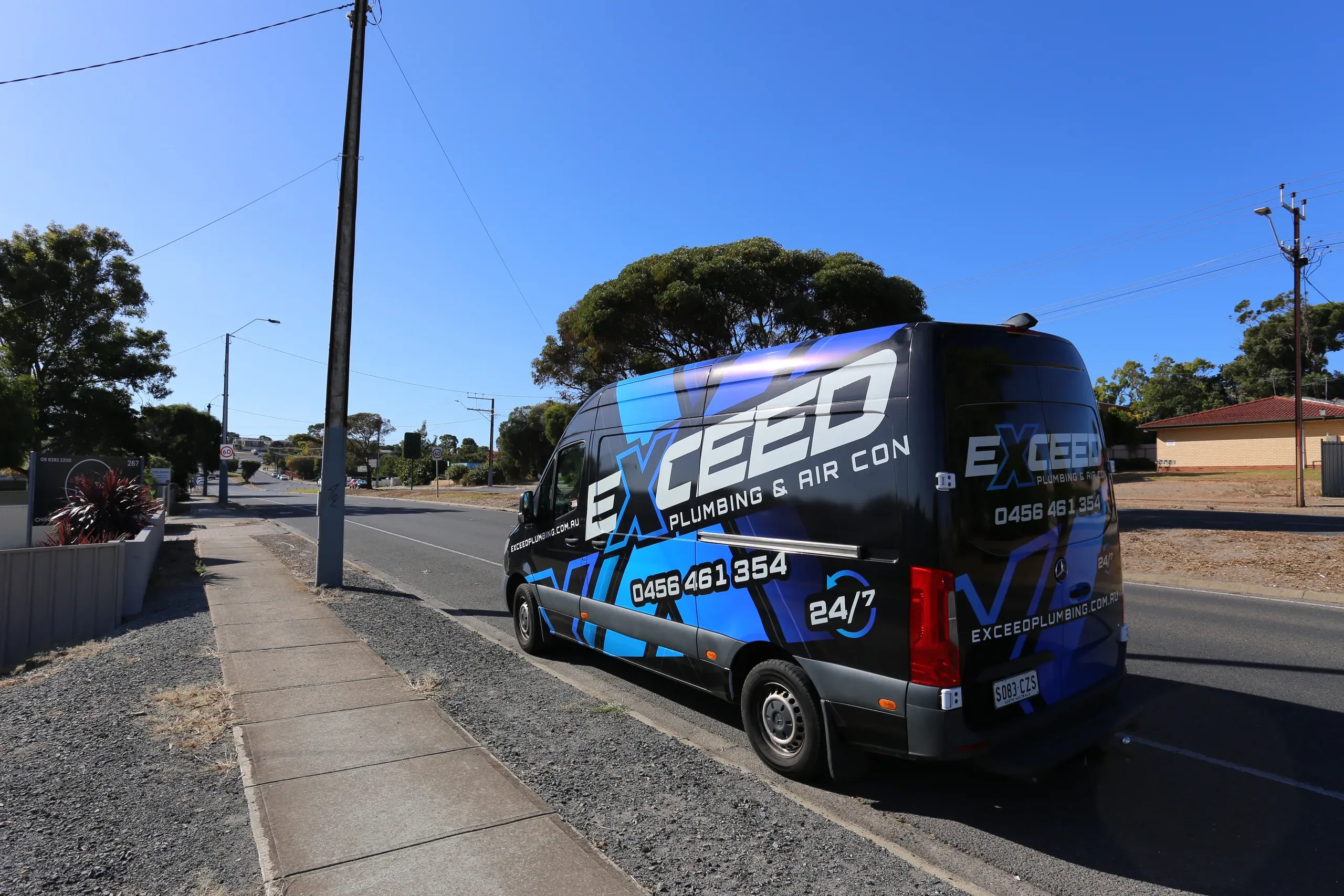 The Exceed Plumbing van parked on a street in Morphett Vale