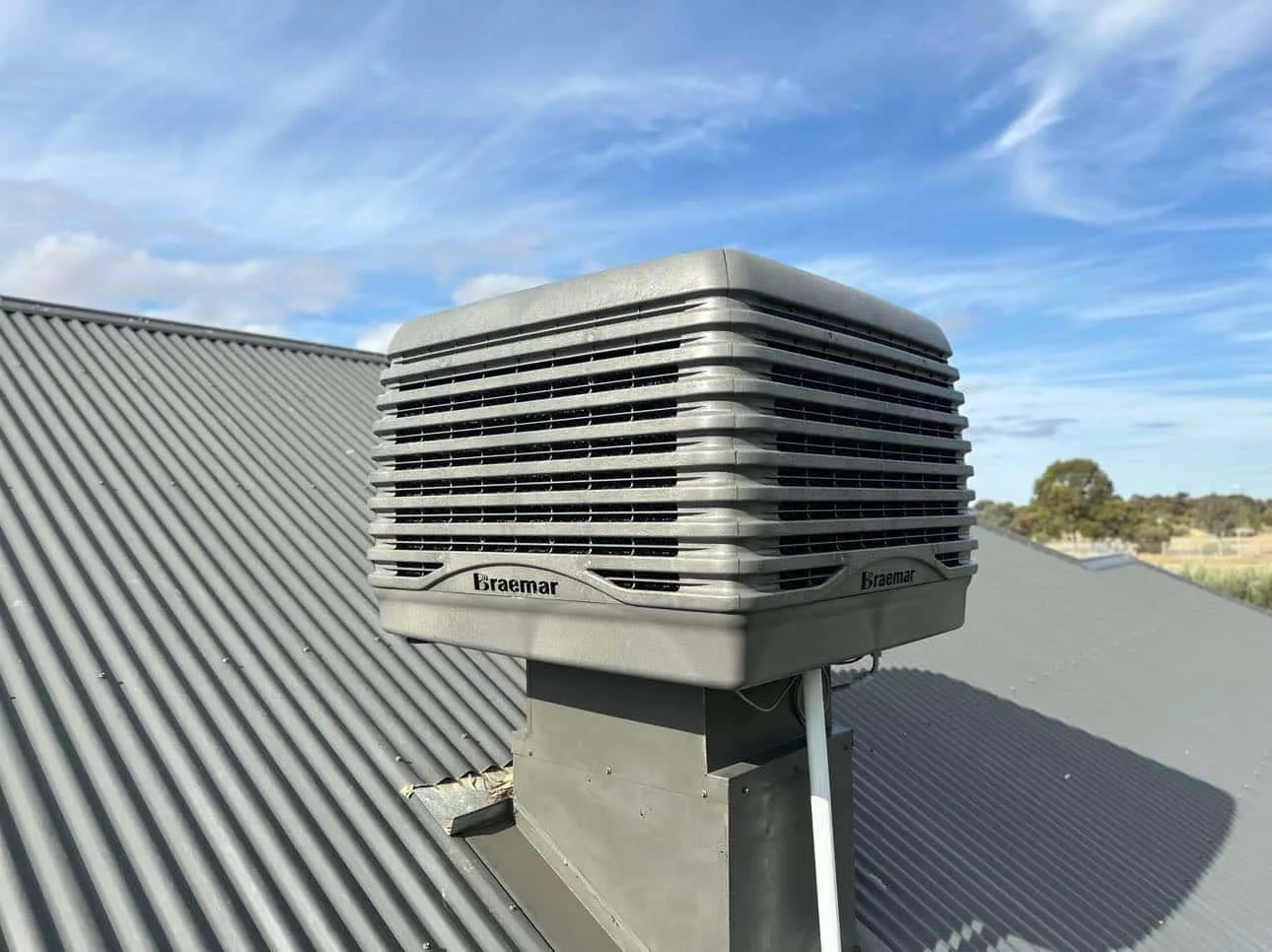Braemar evaporative cooler on a corrugated metal roof