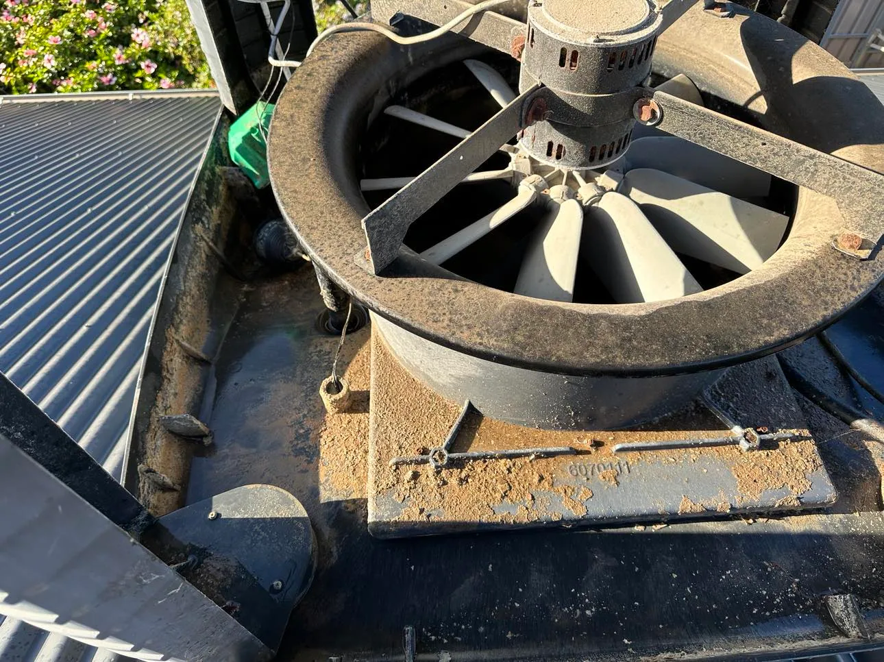 Dusty evaporative cooler fan and motor with the lid off