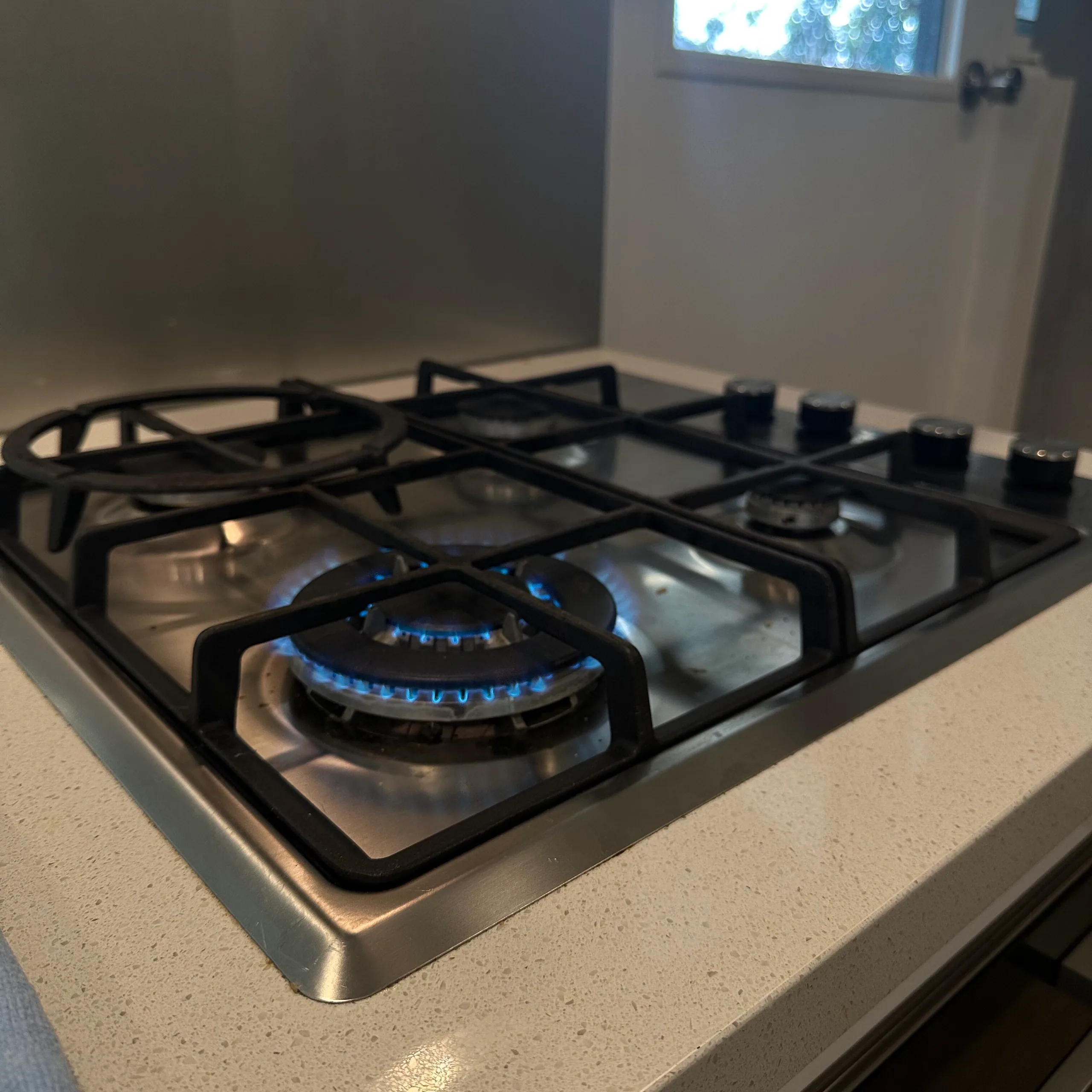 Gas cooktop with a burner lit