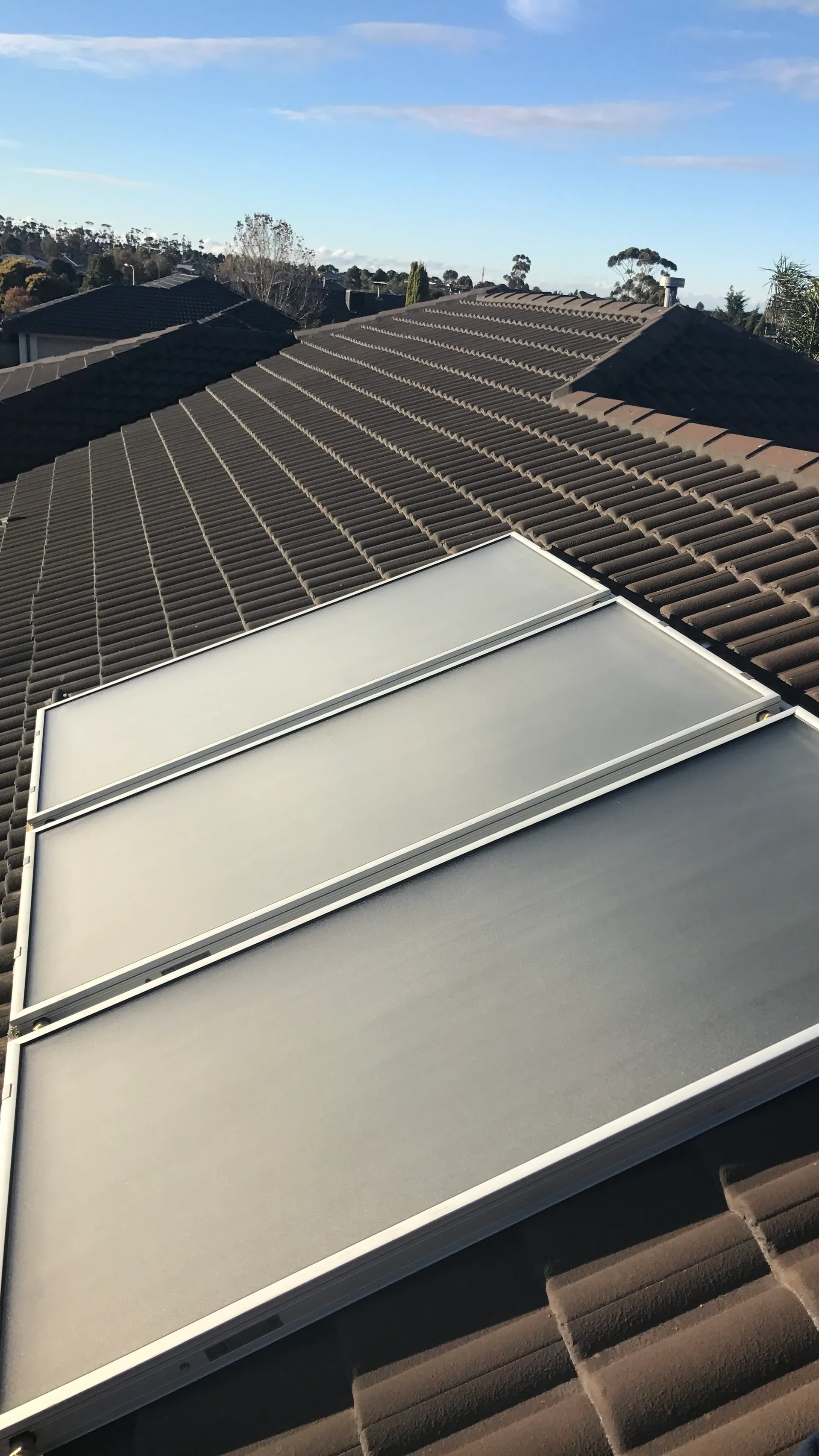 Solar hot water panels on a tiled roof