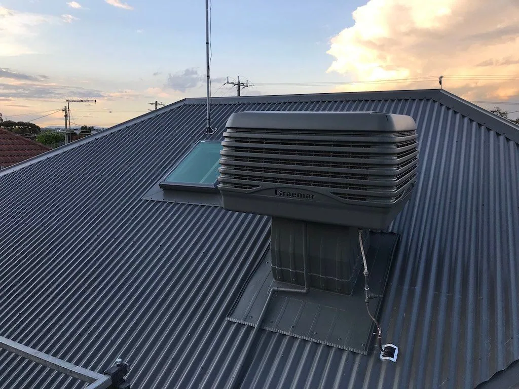 Braemar evaporative cooler on a dark metal roof